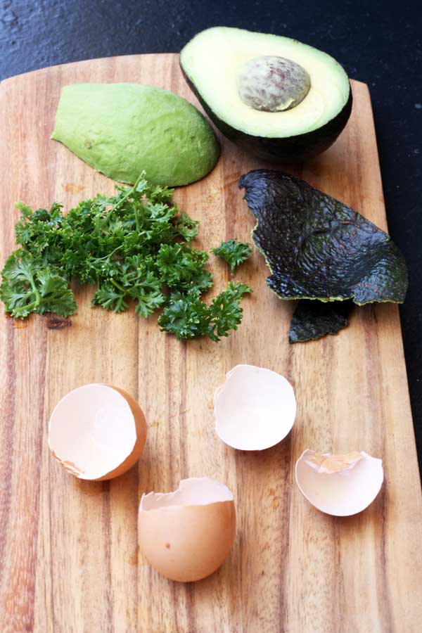 Ingredients for a breakfast of poached eggs with avocado, spinach & crispy quinoa