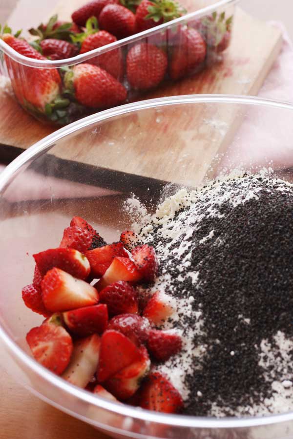 Making strawberry poppy seed ricotta muffins
