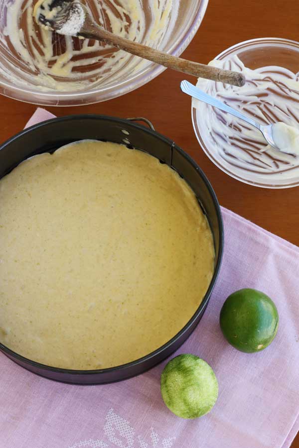 Making white chocolate, coconut & lime truffle cake