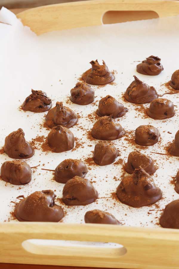 Chocolate orange truffles on a white background