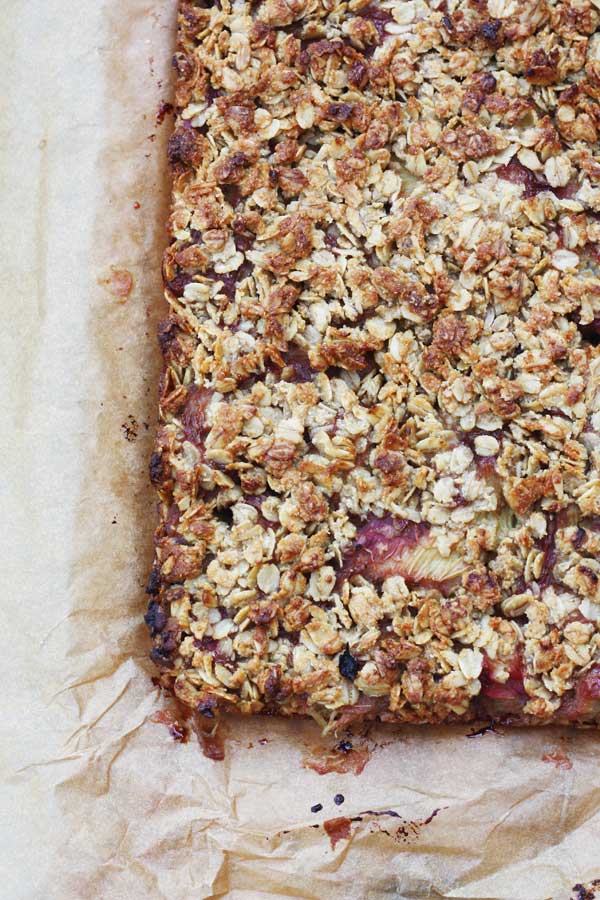 closeup of a A Healthy Oat Slice With Rhubarb And Ginger in a baking pan from above 