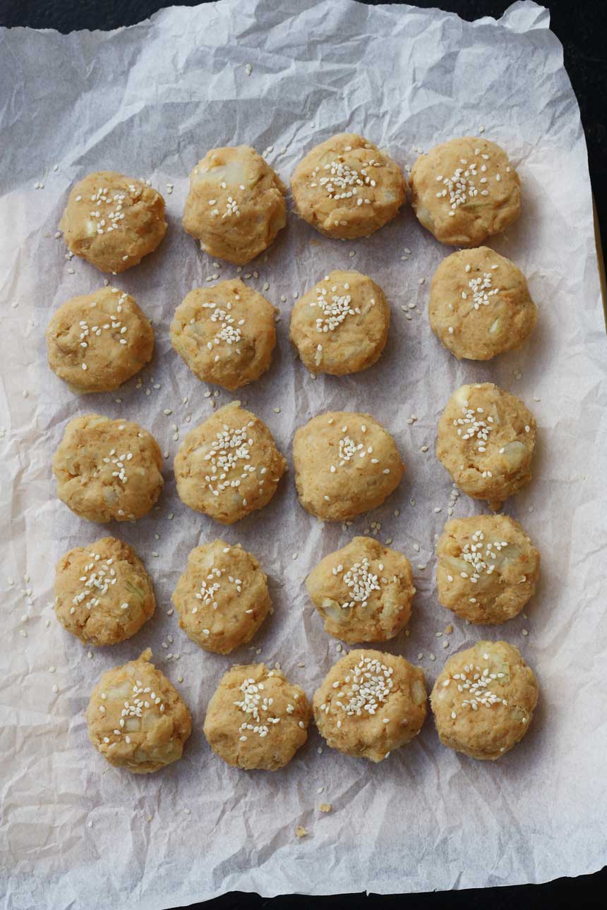 Sweet potato falafel ready to be cooked on a baking tray from above.