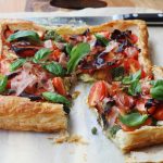 Baby tomato, pesto & prosciutto tart