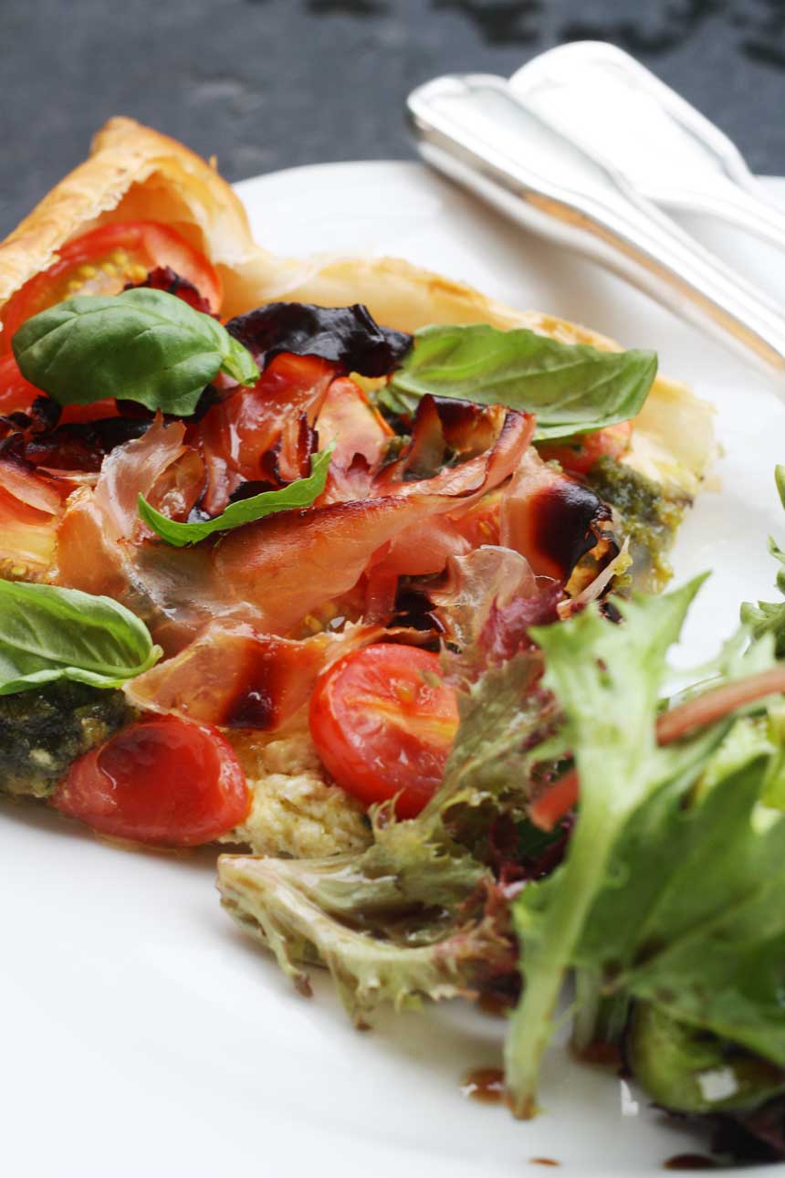 Baby tomato, pesto & prosciutto tart