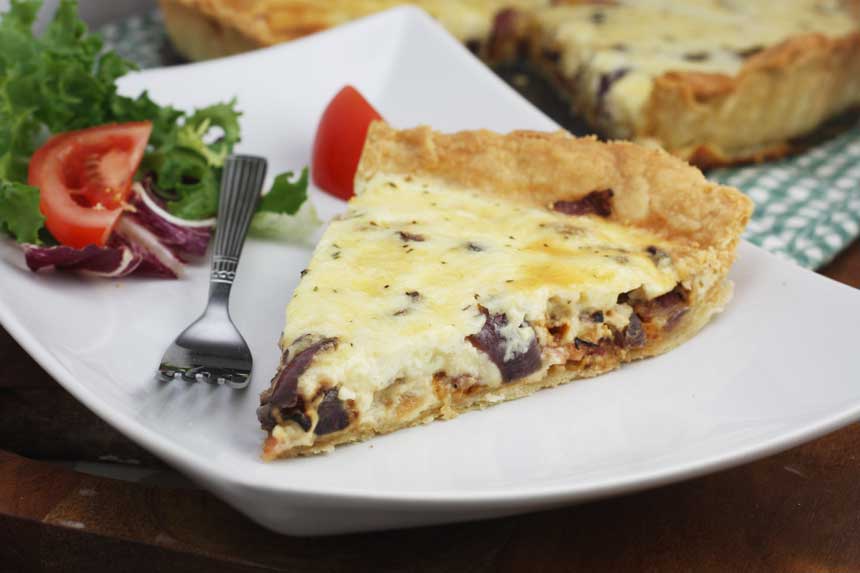 quiche lorraine made with smoked bacon, onions, eggs, cream and