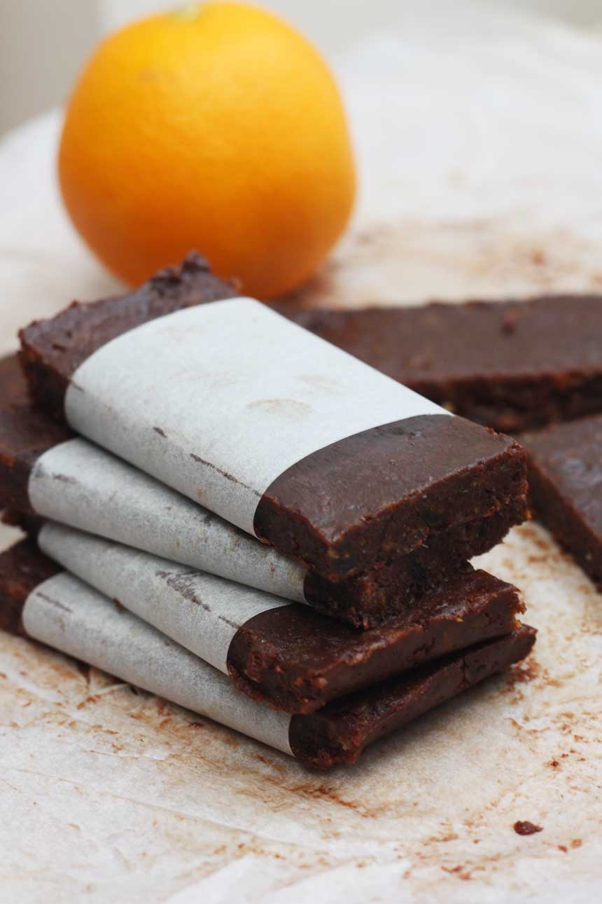5-ingredient healthy chocolate orange date bars stacked up and wrapped in baking paper