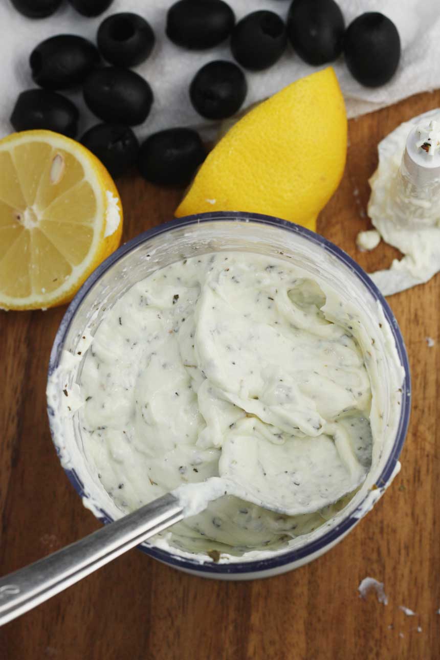 An overhead shot of the filling for Greek fried olives with a half a lemon in the background