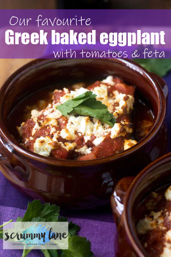 A brown dish of Greek baked eggplant with tomato sauce and feta