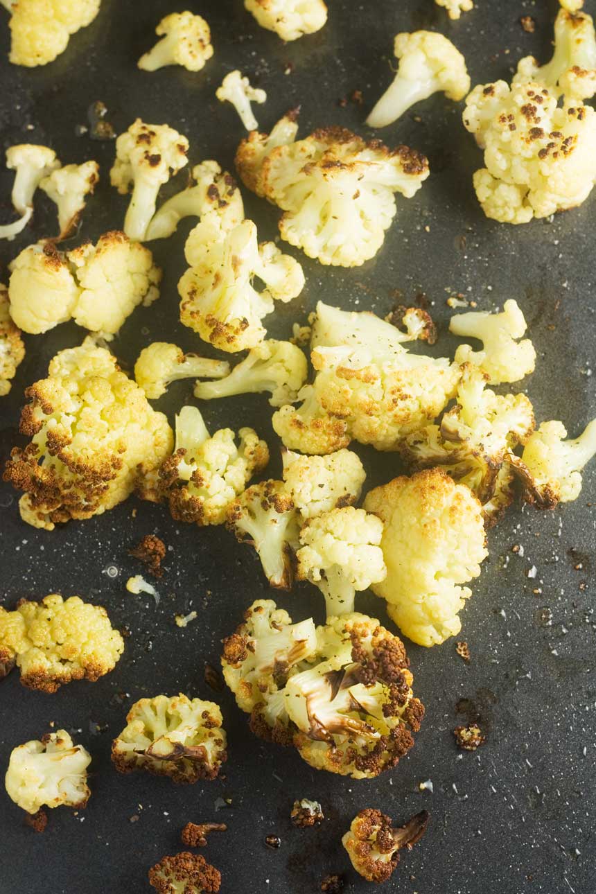 Roasted cauliflower on a baking tray from above