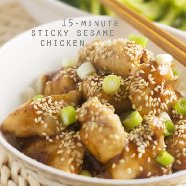A closeup of a bowl of sticky sesame chicken with chopsticks, with a title on it for Pinterest.