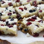 Pieces of Eton Mess fridge cake on baking paper