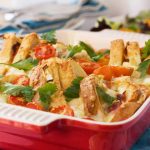 A croque monsieur brunch bake just baked in a red baking dish.