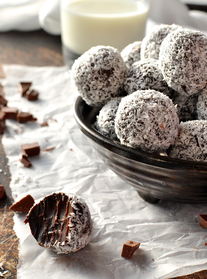 Bowl of Chocolate ganache truffles on baking paper from Recipe Tin Eats.