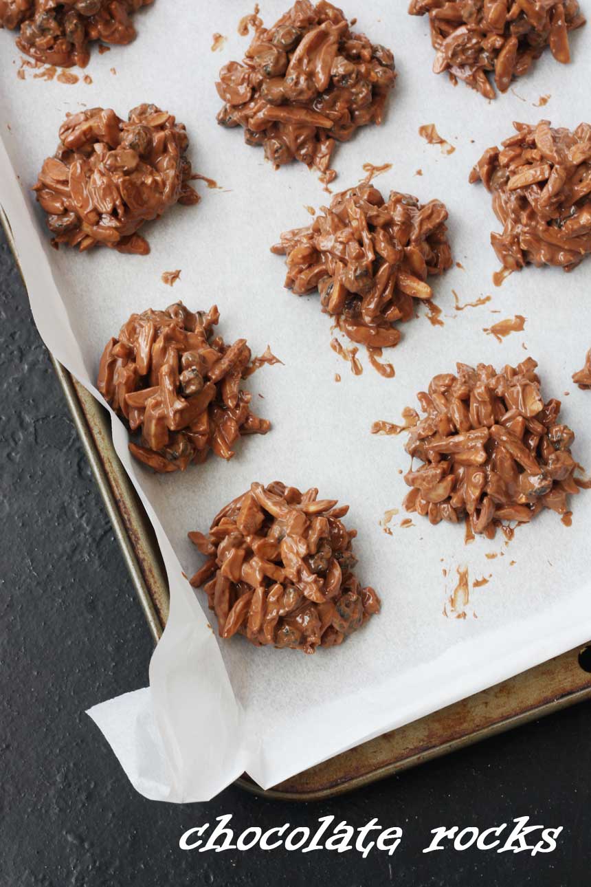 A close up of chocolate rocks on a baking tray with baking paper.