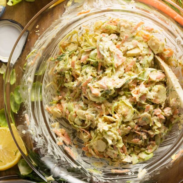 Clear bowl of brussels sprouts coleslaw from above.