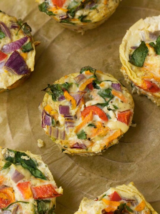 Veggie muffin frittatas on brown paper from above.