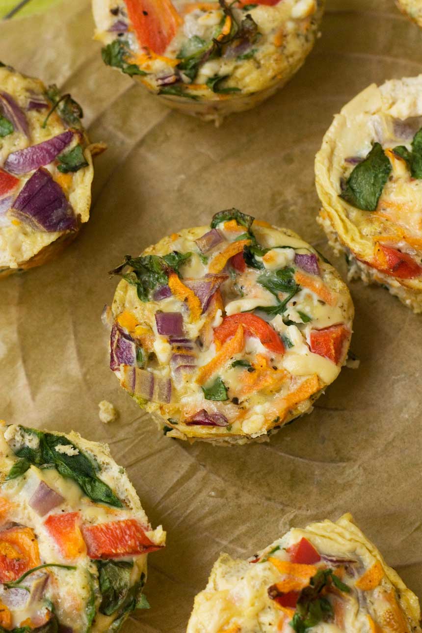 Veggie muffin frittatas on brown paper from above.