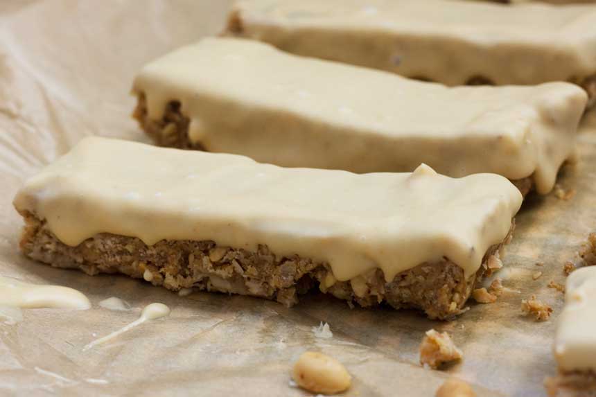 sweet and salty peanut butter granola bars on a piece of baking paper