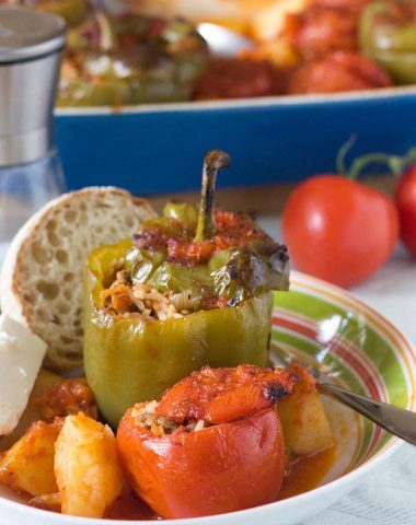 Greek stuffed tomatoes and peppers - Greek 'peasant' food that's remained popular for a reason!