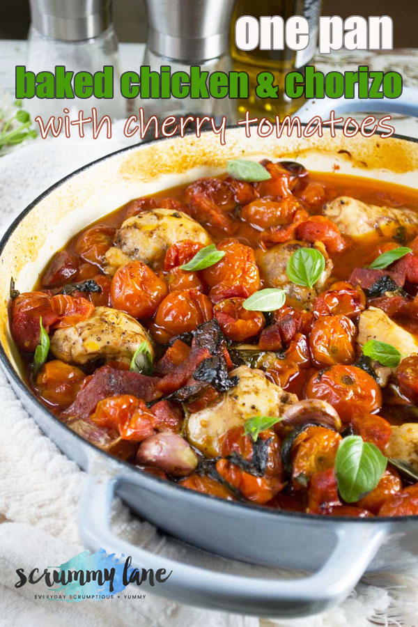 Baked chicken and chorizo with cherry tomatoes in a cast iron pan
