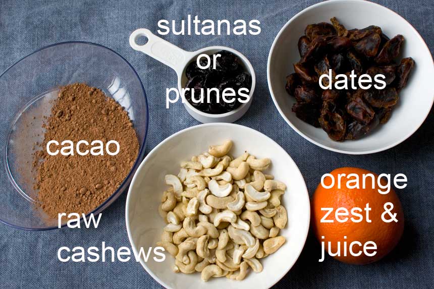ingredients for 5-ingredient raw chocolate orange truffles labelled on a blue background