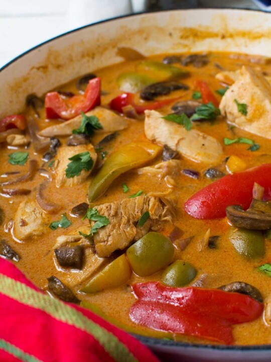 Closeup of paprika chicken in a pan.
