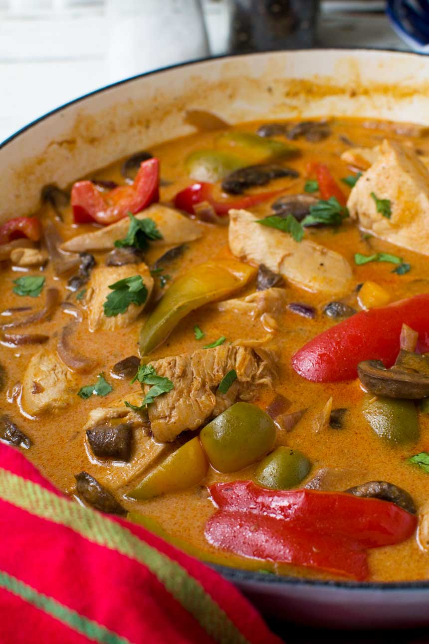 Closeup of paprika chicken in a pan.