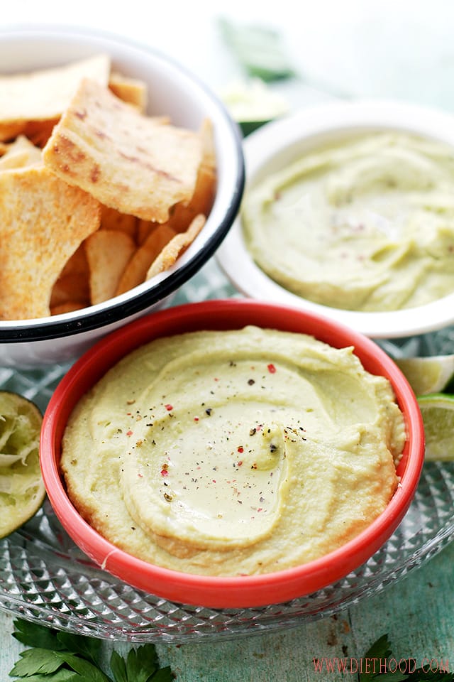 Feta cheese avocado hummus dip in small bowls with chips.