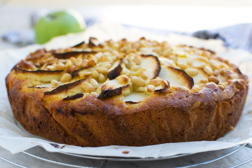 closeup of an easy apple cake (torta di mele) on a cooling rack