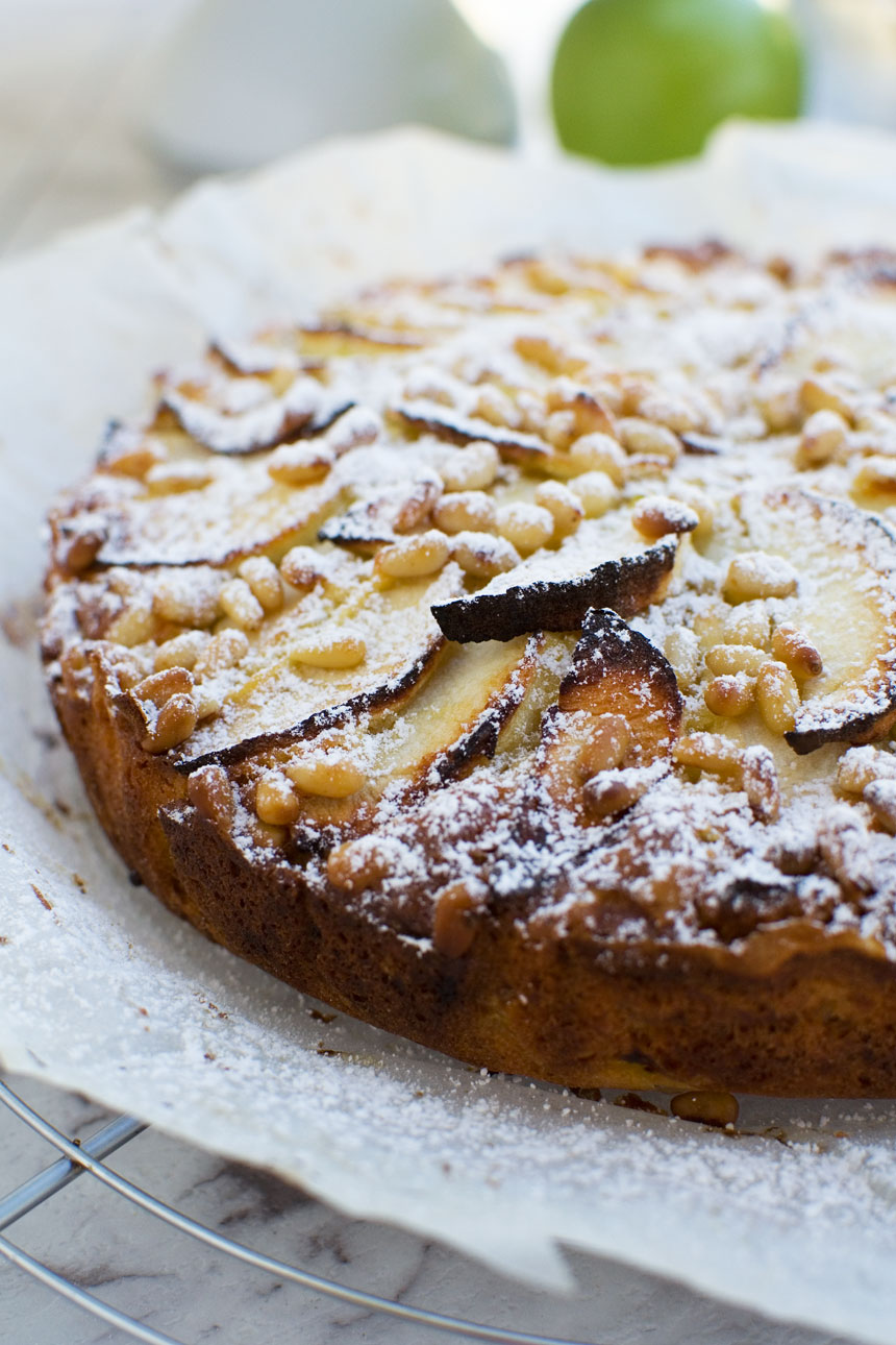 Closeup of an easy apple cake (torta di mele) on a white plate