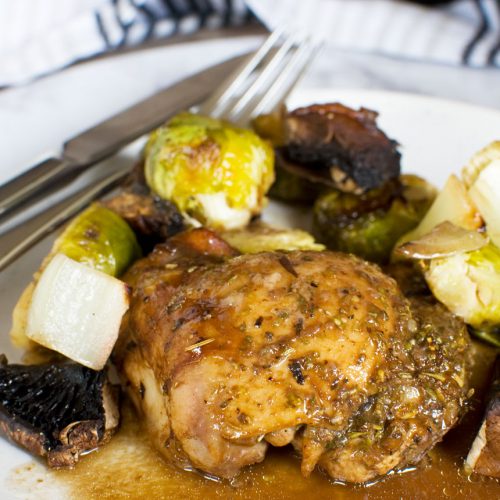 closeup of a plate of Honey balsamic chicken with mushrooms and brussels sprouts