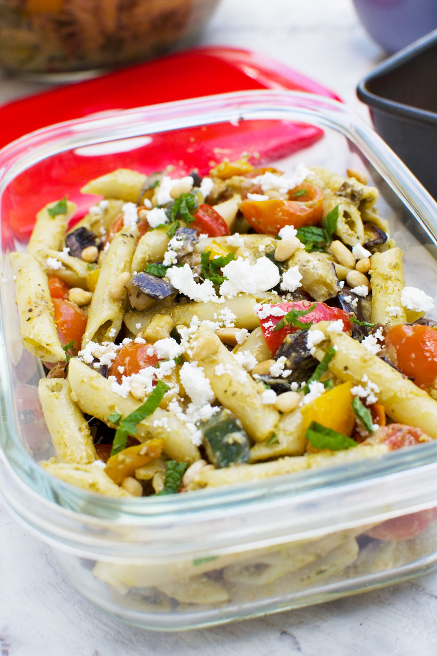 closeup of Mediterranean penne pasta salad in a clear glass container