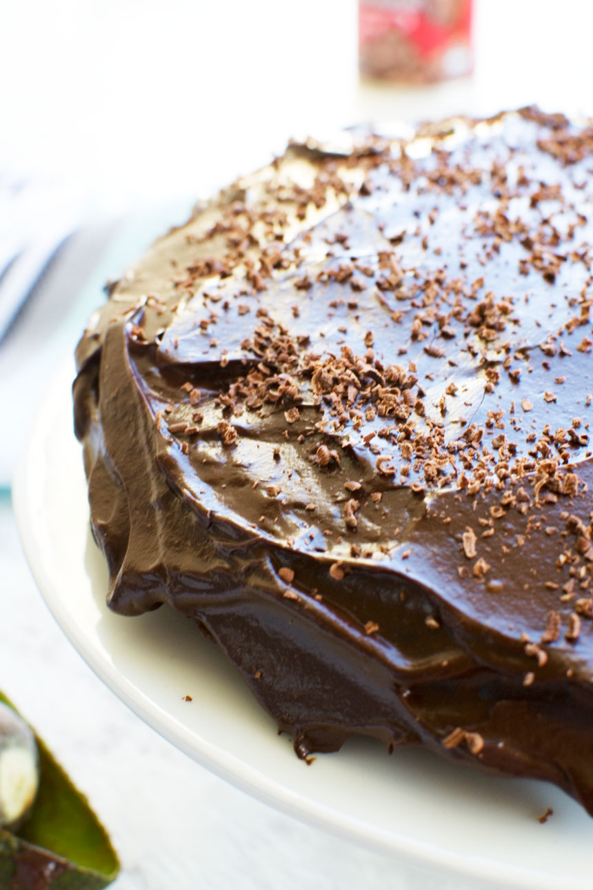 closeup of part of a 30 minute healthy chocolate cake on a white plate