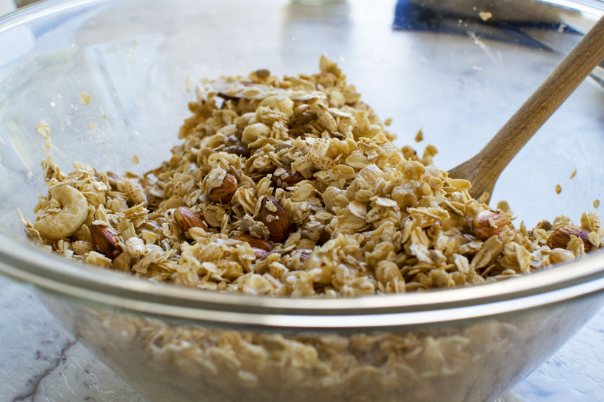 Ingredients for homemade granola in a big glass bowl