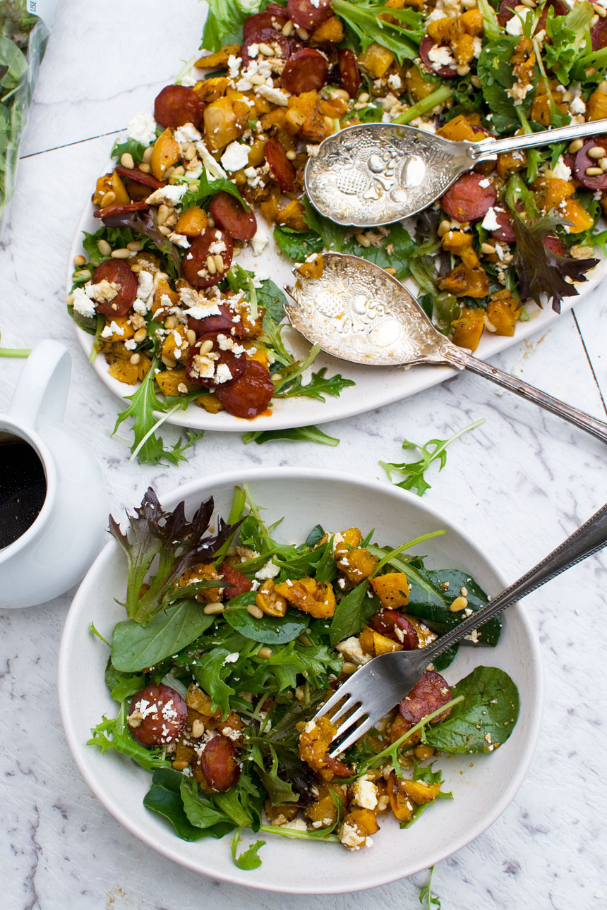 Roast Pumpkin Salad With Feta And Chorizo salad on a platter and on a plate from above