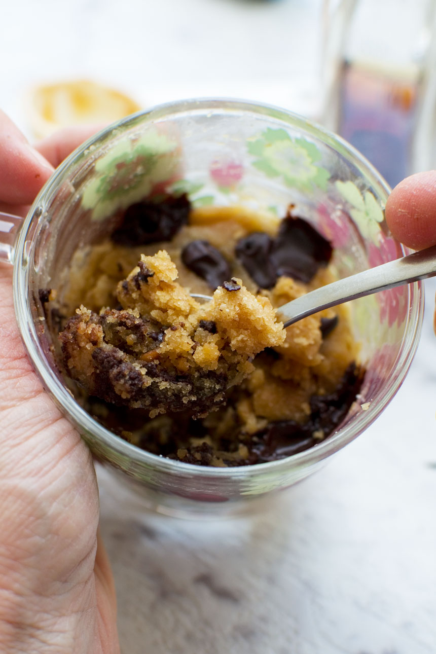 Someone eating a 2-minute peanut butter healthy mug cake - close up
