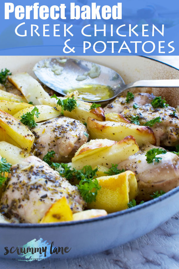 Greek baked chicken and potatoes in a blue cast iron pan