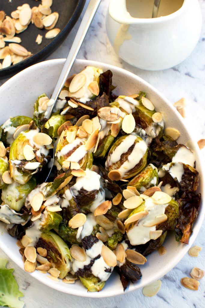 Crispy brussels sprouts with tahini sauce and almonds - overhead