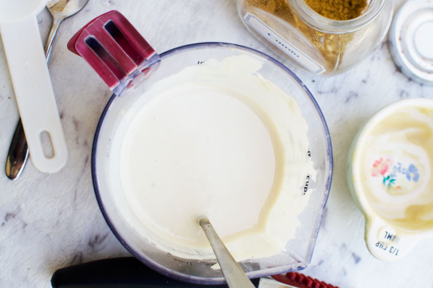 Making a jug of tahini dressing