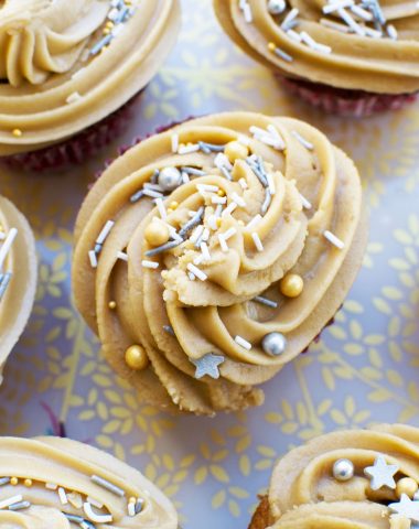 A top view of some gingerbread muffins with salted caramel icing