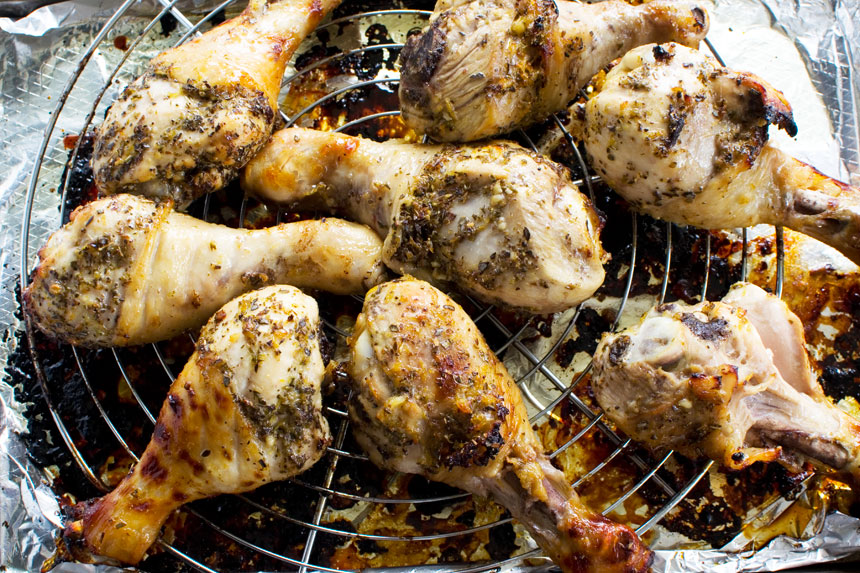 Greek marinated chicken drumsticks just baked on a wire rack