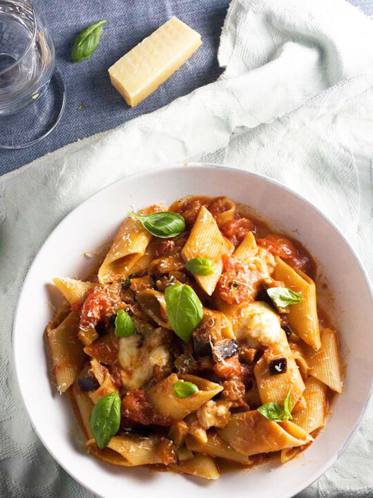 A bowl of pasta alla norma or tomato and eggplant pasta from above