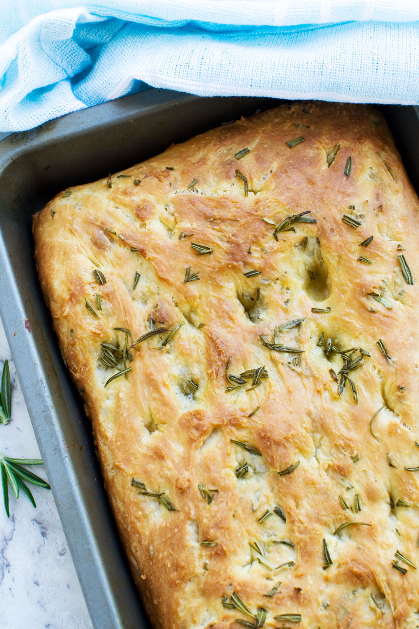 A pan of freshly baked Italian focaccia bread from above