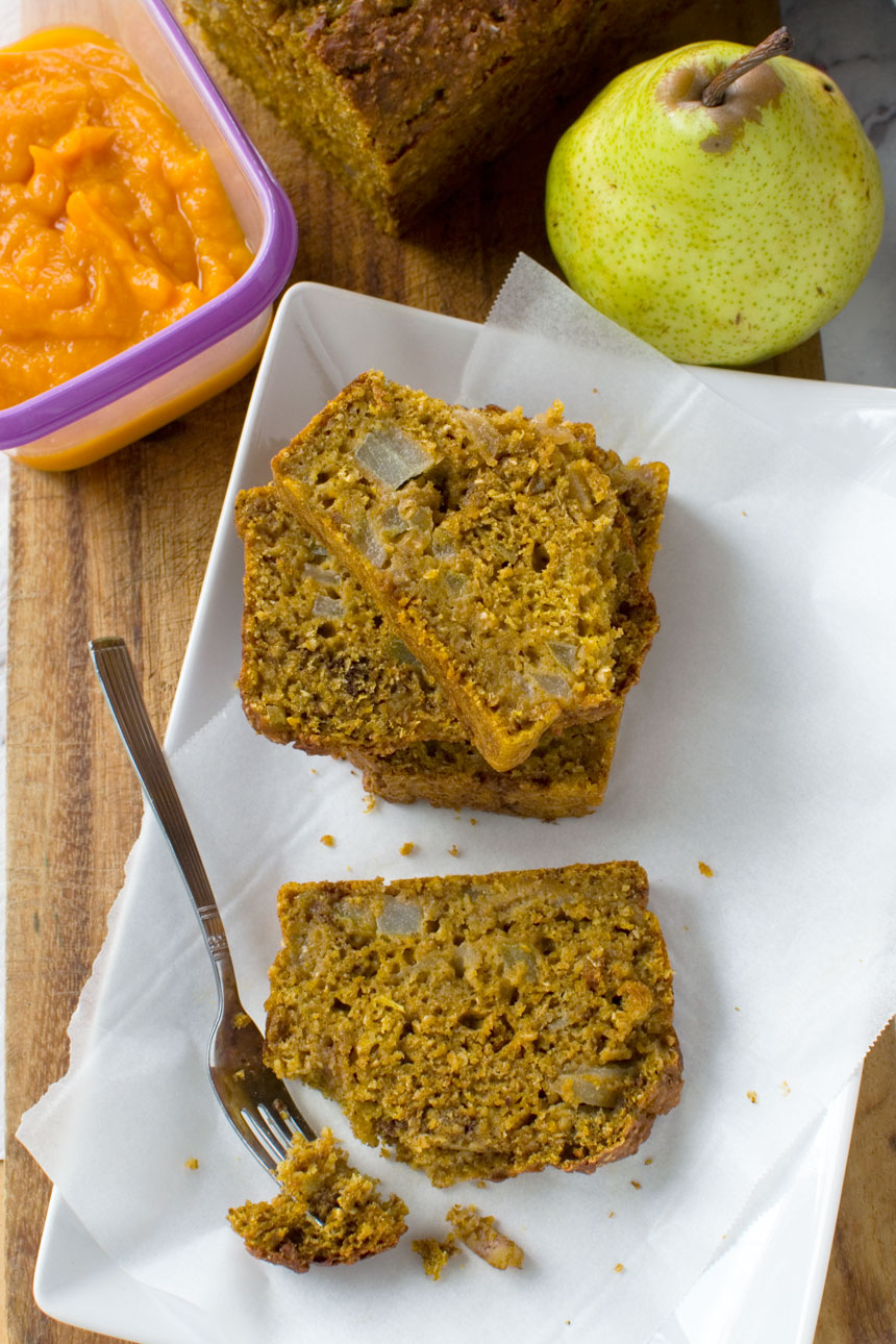 Slices of healthy pumpkin and pear bread on a plate from above