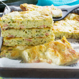 A stack of zucchini slice on a baking tray