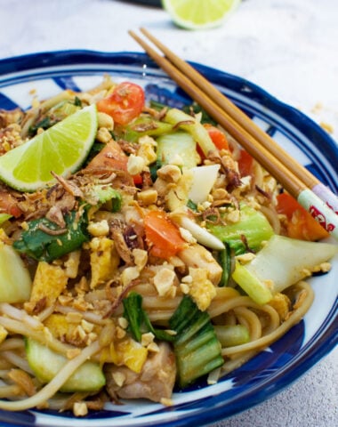 A dish of mee goreng basah or spicy Indonesian noodles with chopsticks