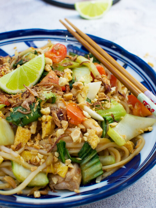 A dish of mee goreng basah or spicy Indonesian noodles with chopsticks