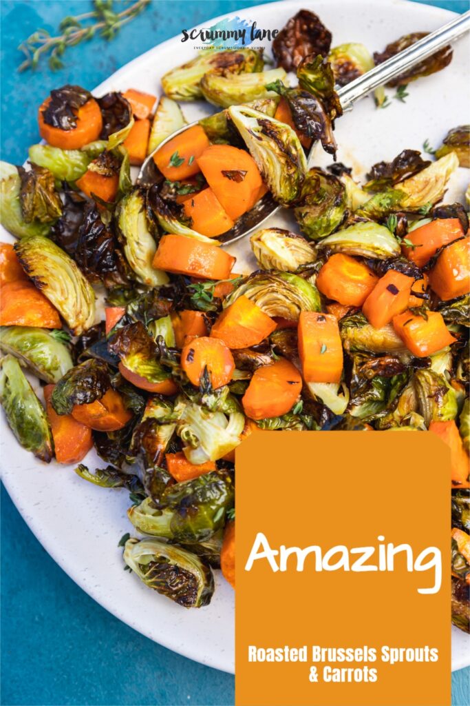 Closeup of white plate of brussels and carrots on a blue background for Pinterest