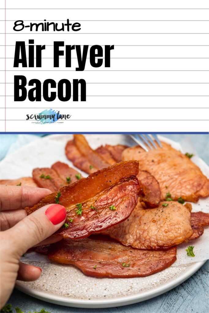 Someone holding up a piece of air fried bacon over a plate of it with a title at the top in black for Pinterest