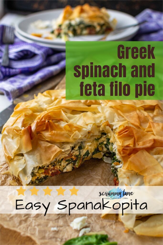 A whole Greek spinach and feta filo pie with a piece cut out of it with titles on it for Pinterest.